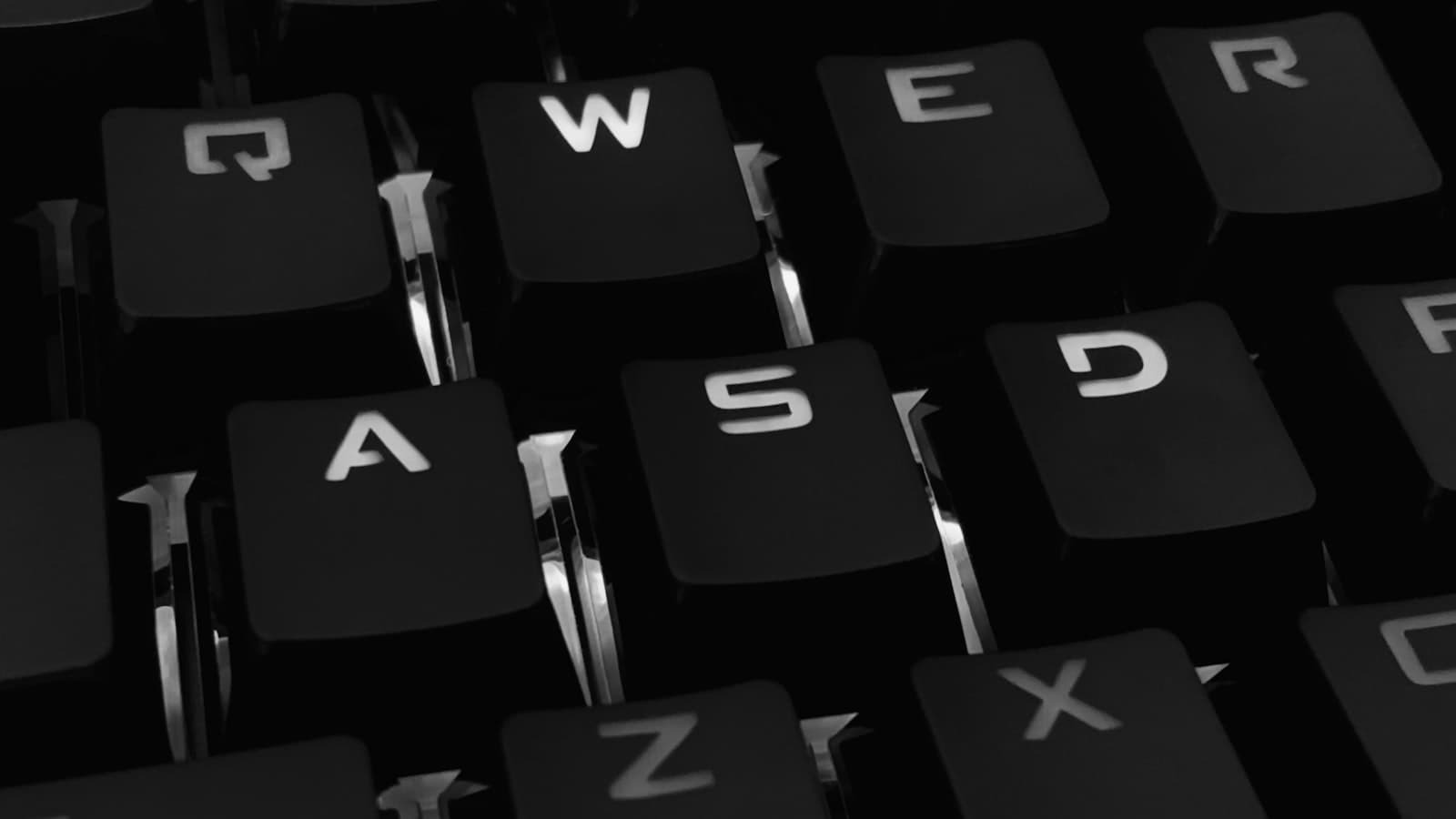 Black and white close-up photograph of a mechanical keyboard