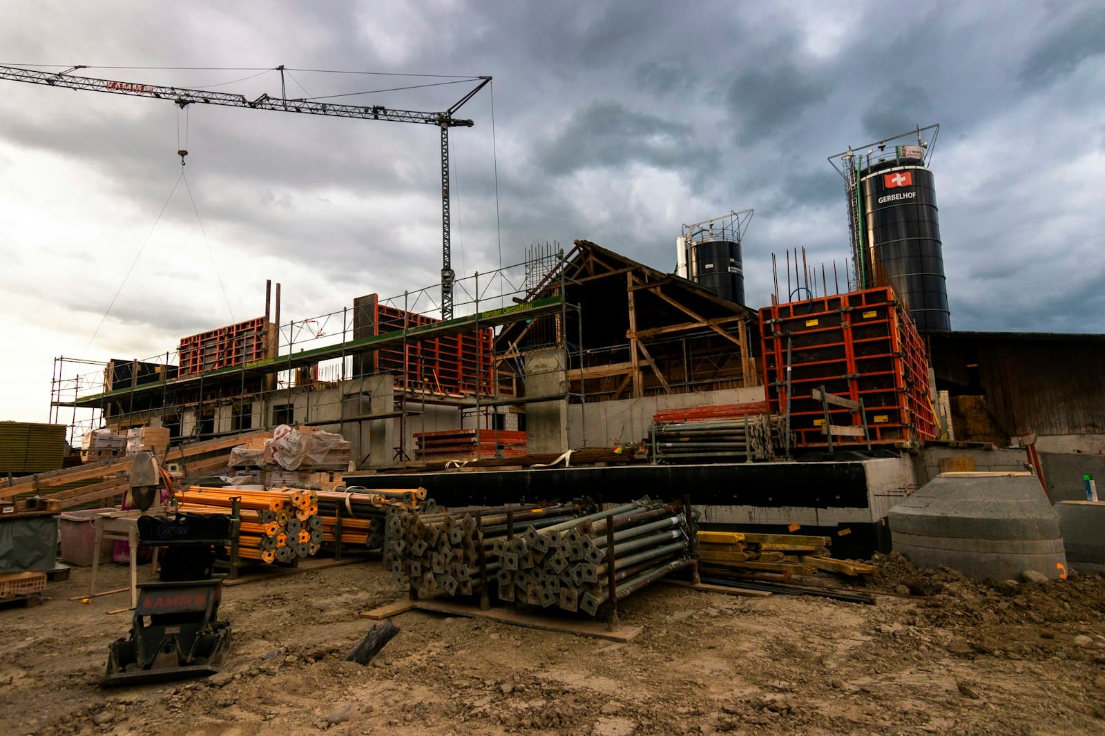 Google Ads vs Facebook Ads for Contractors A construction site with a crane in the background