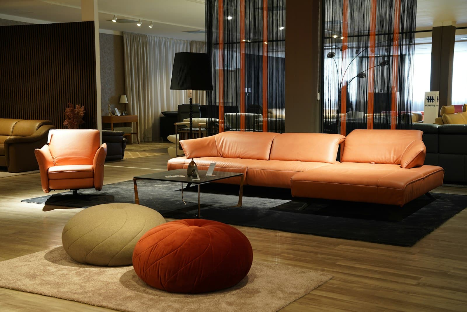 A living room filled with furniture and a large window