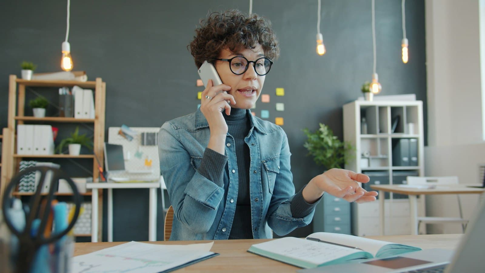 A business owner taking a customer call