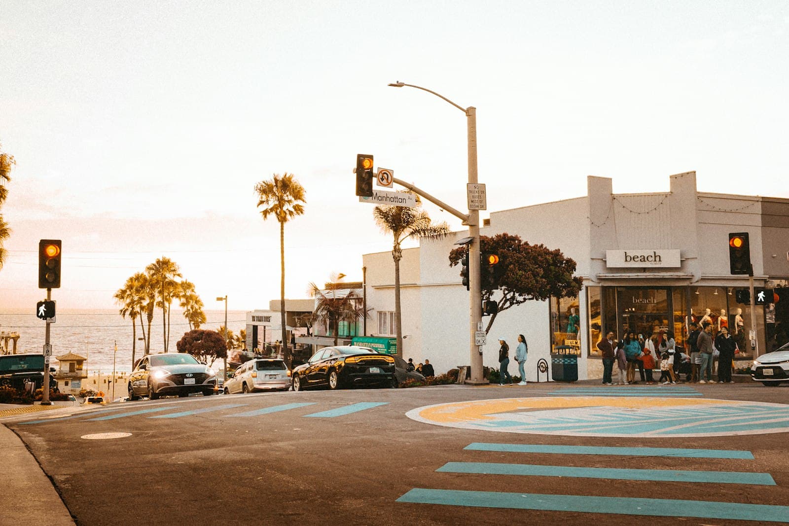 Coastal town street scene with palm trees and ocean
