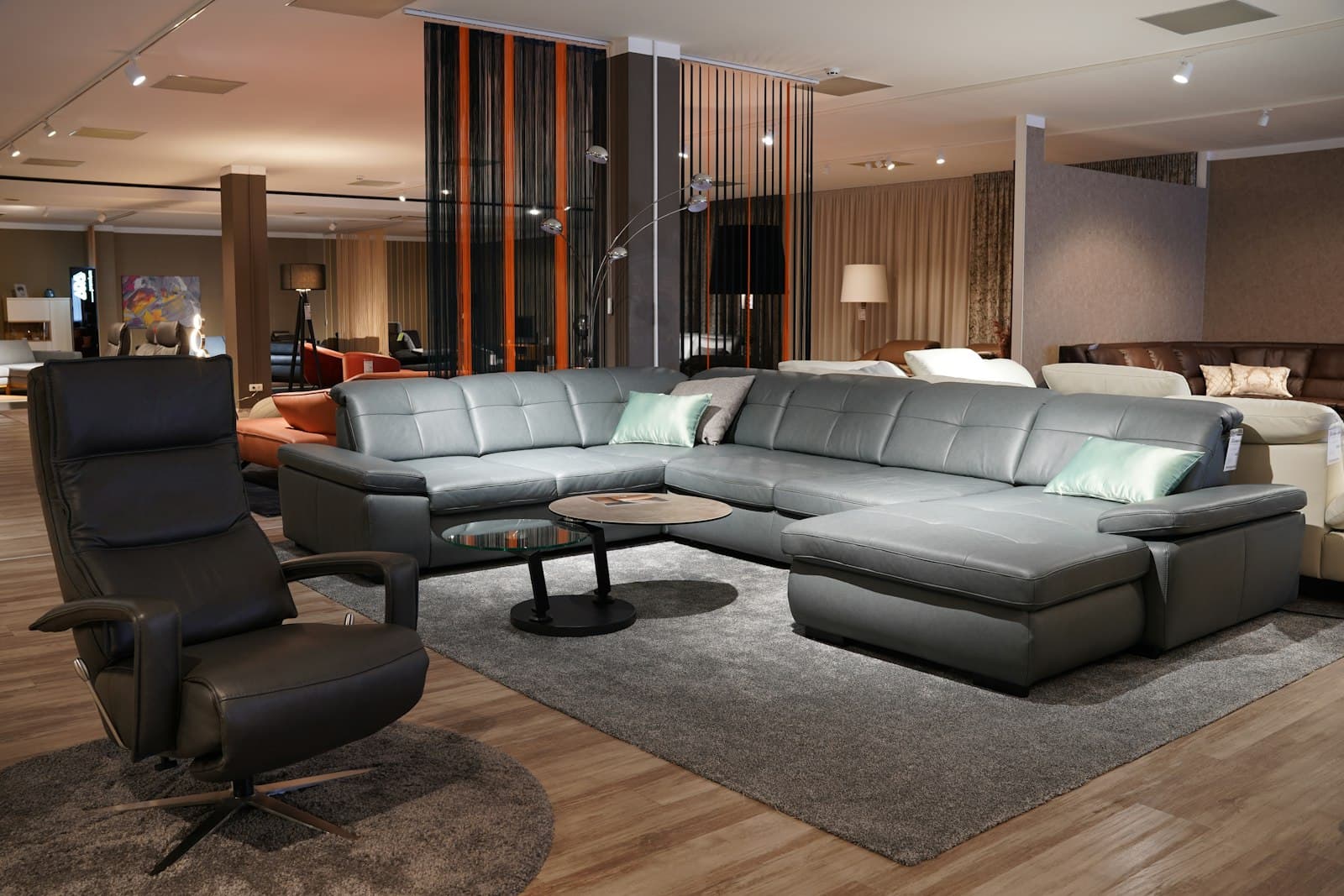 A living room filled with furniture and a wooden floor